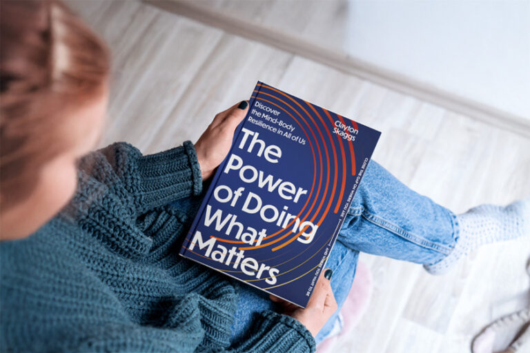 a lady preparing to read the book, The Power of Doing what Matters